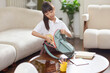 © Blue Jean Images - A girl packing her schoolbag