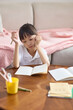 © Blue Jean Images - A girl doing her homework at her desk