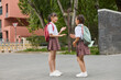 © Blue Jean Images - Two happy girls after school