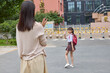© Blue Jean Images - Mum taking her daughter to school
