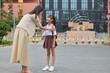 © Blue Jean Images - Mum taking her daughter to school
