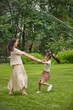 © Blue Jean Images - Mum and daughter having fun in a park