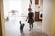 © Westend61 - Girl walking with British Shorthair cat at home
