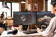 © DC Studio - Young female developer working on industrial gear models with dual monitors and computer aided design tools. Creative remote engineer visualizing prototypes in modern home studio.