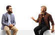 © Ljupco Smokovski - Two bearded men sitting and talking