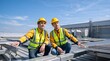 © Vasiliy - Two male engineers inspecting solar panels on a commercial roof. Workers in safety vests and helmets discussing renewable energy installation
