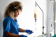 © Carmen - Nurse preparing iv drip for patient liquid nutrition