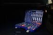 © Natallia - Socket wrench toolbox in the trunk of a black car.