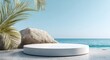 © morepiixel - A serene beachfront scene featuring a circular platform, palm leaves, and large rocks against a clear blue sky and calm ocean.