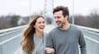 © Tamaras Pictures 4U - Happy couple laughing while walking on bridge during winter