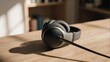 © Maz - A pair of over-ear headphones resting on a wooden table, with shadows and a blurred bookshelf