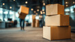 © AnastasiiaAkh - Stacked cardboard boxes in modern office interior with moving workers carrying packages relocation and delivery service concept