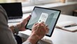 © Justlight - Freelancer interacting with a peertopeer lending app on a tablet uploading tax returns and project contracts with clear focus on hands and interface.