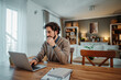 © Dusan - Man working remotely from home using laptop