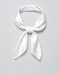 © Nigeria - Elegant white silk scarf tied in a neat knot against a gray backdrop