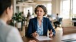 © Justlight - Financial expert advising a service firm client on credit line benefits for operational growth with the focus on the advisor and blurred business environment.