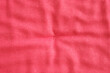 © DavidIgSu - Red fabric textile material surface with texture and folds