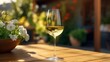© Magic Stock - A photo of a glass of chilled white wine on a table