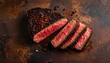© wanmai - Slices of grilled beef steak medium rare with black pepper on dark rustic background