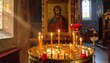 © kih - A serene chapel interior with a large icon and candles