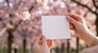 © Alena - Woman holding Valentine's Day mockup card in park