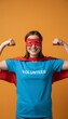 © olga_demina - Young woman volunteer in red mask and cape flexes her arm, smiling confidently to symbolize strength, empowerment and joyful community service and charitable support