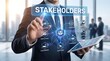 © Muhammad - Stakeholder Management Business Businessman Pointing at Digital Network with Investors, Employees, Customers, Suppliers & Community Icons on Tablet Interface