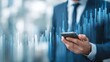 © sup - Businessman with phone and digital graphs