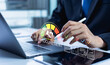 © Father_Studio - Businessman manages a digital procurement process on a laptop and tablet, reviewing a supplier approval dashboard to streamline purchasing decisions and improve supply chain efficiency.