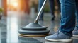 © Alex Pios - Cleaning floor with machine in office setting to maintain hygiene and cleanliness during daytime hours for a commercial environment