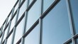 © Shahid - A modern office building with large glass windows and a sleek exterior design