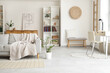 © Pixel-Shot - Interior of stylish living room with grey sofa, houseplant and shelving unit