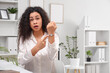 © Pixel-Shot - Shocked African-American businesswoman pointing at wristwatch in office. Time management concept