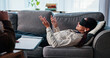© peopleimages.com - Woman, relax and talking for therapy session in office with hypnotherapy, guidance and technique. People, therapist and counseling notes for sensory awareness, healing subconscious and rehabilitation