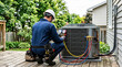 © Александр Марченко - Hvac technician servicing outdoor residential air conditioning unit