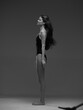 © SHOTPRIME STUDIO - Black and white profile of a tall slender woman standing with closed eyes against a neutral background