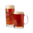 © tonostock - Two glasses of amber ale beer with foam on a white background.