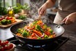 © Art & Design by Olya - Cooking Fresh Vegetable Stir Fry in Wok with Steam Healthy Home Kitchen Meal Preparation