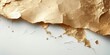 © antishock - Gold leaf fragments rest upon white surface. Texture contrasts sharply against dark background. Delicate, brittle material shows damage.