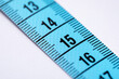 © New Africa - One measuring tape on white background, closeup