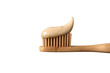 © PNG Kingdom  - Bamboo toothbrush loaded with natural beige toothpaste, representing sustainable dental care and environmentally conscious hygiene