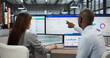 © Andrey Popov - An African Man And American Woman Collaborating On A Loyalty Dashboard