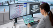 © Andrey Popov - Female Engineer Operating BIM And GIS Tools For Digital Twin Creation