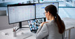 © Andrey Popov - Female Compliance Officer Reviewing Regulations Dashboard During Virtual