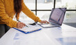 © groviapoto - A person conducting an analysis of financial reports on a laptop, emphasizing the utilization of digital tools for data interpretation and informed decision-making.