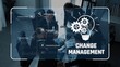 © InfiniteFlow - Group of professionals engaged in a business meeting discussing change management strategies with visual aids, promoting collaboration for organizational success. Raster