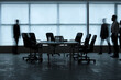 © Pixel-Shot - Silhouettes of moving business people in office