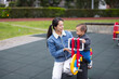 © leungchopan - Mother playing with baby on rocking chair at park