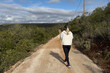 © Angelov - caucasian young woman on a hiking trail on the mountain,