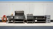 © Click - A well-organized outdoor kitchen setup with various grills and cooking equipment on a concrete surface outside a large industrial building.